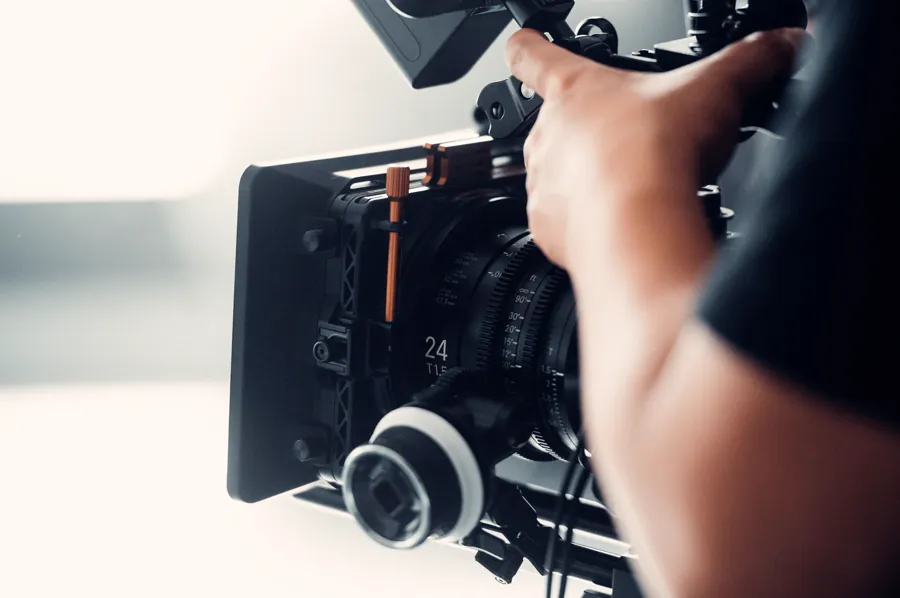 A professional cinema camera being operated on a video production set